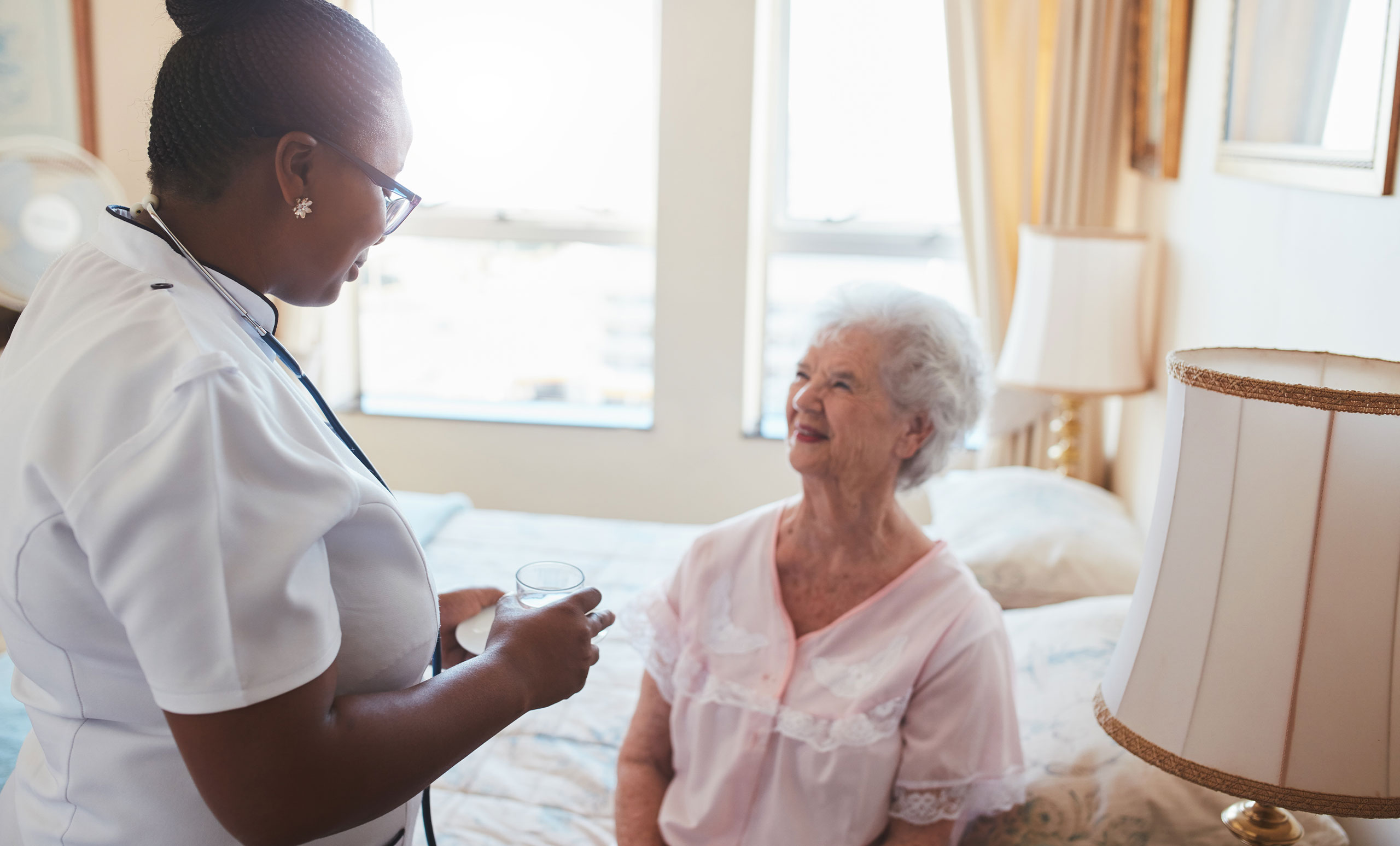 Palliative care nurse caring for patient