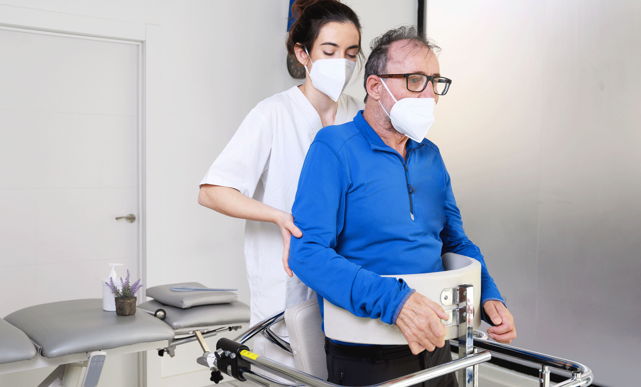 man with cerebral palsy being helped by nurse