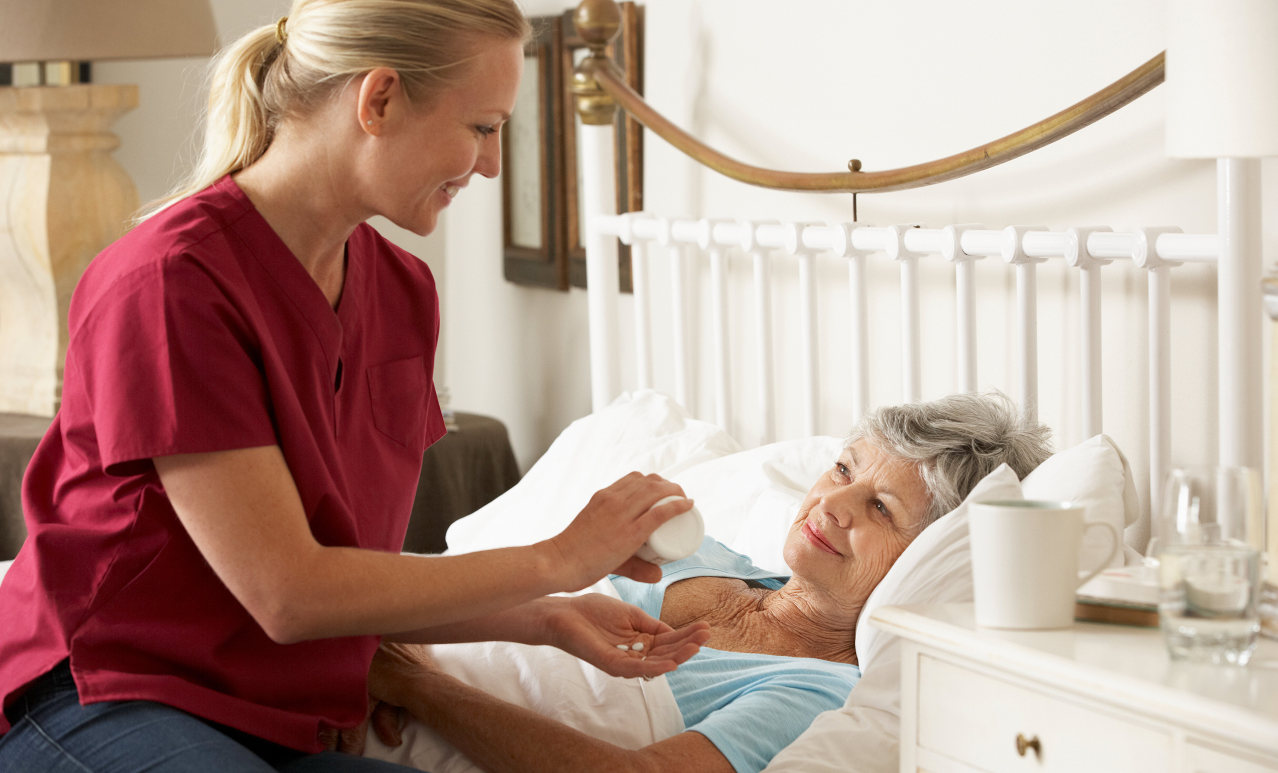 Palliative care nurse caring for patient